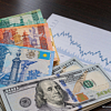 Тенге укрепился до 448, Минфин занял 128 млрд вместо 120. Госбумаги на 2–7 лет — под 13,9–15,3%